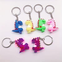 تعليقات مفاتيح ديناصور لون وردي وبنفسج