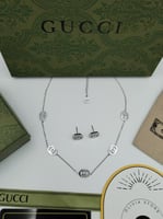 طقم سلسال وحلق قوتشي