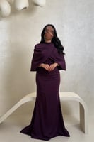 فستان بنفسجي غامق بتفاصيل خرز وتصميم راق