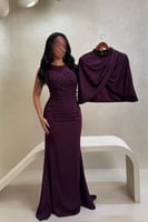 فستان بنفسجي غامق بتفاصيل خرز وتصميم راق