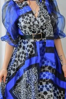 فستان أنيق يجمع بين الفخامة والعصرية مزين بنقوش هن...