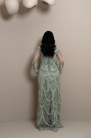 فستان زيتي فاتح بتفاصيل فاخرة من مليحة