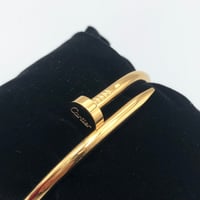 سوارة كارتير مسمار ستيل ذهبي