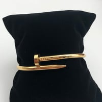 سوارة كارتير مسمار ستيل ذهبي