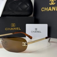 نظارة شانيل بدون إطار باللون الذهبي وعدسة بني