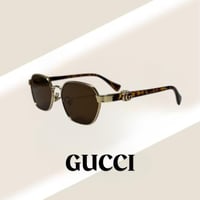 نظارة قوتشي باللون الذهبي وذراع تايقر بشعار GG