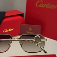 نظارة كارتير بدون أطار باللون الذهبي وشعار دائري