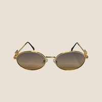 نظارة mيو ميو باللون الذهبي