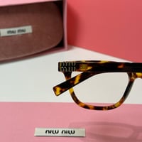 نظارة ميو ميو كلاسيك باللون التايقر وعدسة شفافة