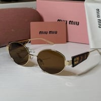 نظارة ميو ميو ذهبي وتايقر