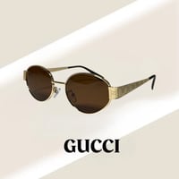 نظارة قوتشي باللون الذهبي وعدسة بيضاوية باللون الب...