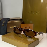 نظارة قوتشي باللون التايقر وشعار ذهبي