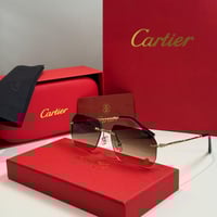 نظارة كارتير بدون إطار بذراع نحيل ذهبي وعدسة بنية