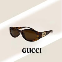 نظارة قوتشي باللون التايقر وشعار ذهبي