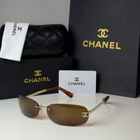 نظارة شانيل بدون إطار باللون الذهبي وعدسة بني