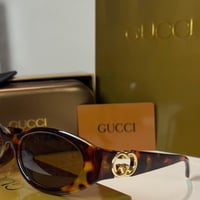 نظارة قوتشي باللون التايقر وشعار ذهبي