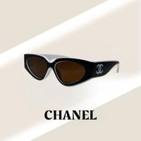 نظارة شانيل Cat Eye باللون الابيض والاسود وعدسة بن...