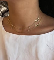 قلادة نسائية بتصميم اسمين مع لؤلؤ