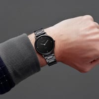 ساعة تيتان إيدج كوارتز أنالوج بمينا أسود وسوار من...