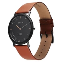 ساعة تيتان كوارتز أنالوج بمينا أسود وسوار جلدي للر...