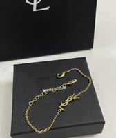 سوار سان لوران ذهبي