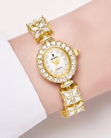ساعة ستيل مزخرفة بالزركون تصميم ذهبي مينا ابيض للن...