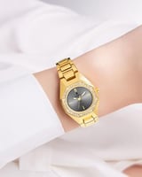 ساعة نسائية ذهبية مزينة بالزركون مينا رمادي