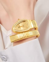 ساعة نسائية بمينا ذهبي وتصميم كوبرا ستانلس ستيل -...