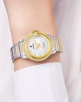 ساعة يد نسائية لون ذهبي فضي مزينة بالزركون