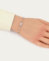 إسوارة نسائية ناعمة تصميم فضي مع حلية على شكل X