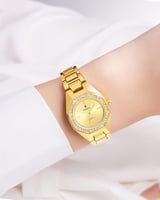 ساعة نسائية ذهبية مزينة بالزركون