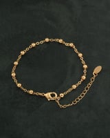 اسوارة ناعمة بتصميم رقيق مزينة بأحجار ذهبية