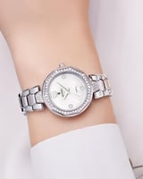 ساعة يد فضية للنساء بإطار مزخرف بالزركون