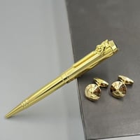 قـلم وكـبك باللون الذهبي