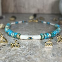 قلادة الفيروز مع اللؤلؤ وتعليقة البرج – حماية، نقا...