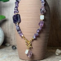 قلادة أماثيست مع كات آي – صفاء، حماية، وتوازن داخل...