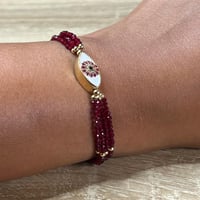 أسورة الياقوت مع خرزة العين – طاقة الشغف والحماية