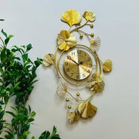 ساعة ولوحه جدارية حديد مطلية باللون الذهبي مع اغصا...