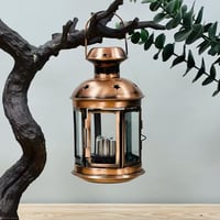 فانوس حديد نحاسي مع شمعة تعمل عالبطارية