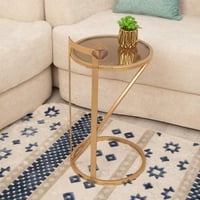 طاولة خدمة القاعدة حديد لون ذهبي والسطح زجاج شفاف...