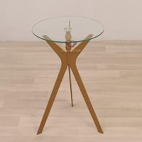 طاولة خدمة السطح زجاج شفاف والقاعدة حديد لون ذهبي