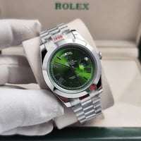 ساعة رولكس رجالية فضي ميناء اخضر