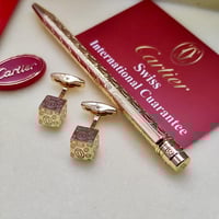 قلم وكبك كارتير ذهبي