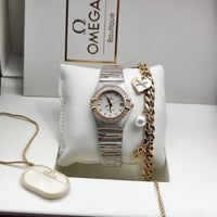 ساعة اوميغا نسائية فضي ذهبي
