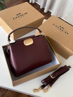 حقيبة كوتش إليزا عنابي