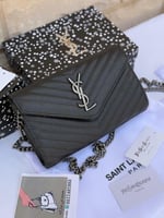 حقيبة سان لوران فضي مستر كوالتي