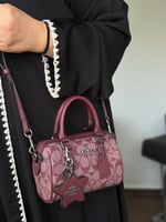 حقيبة كوتش عنابي