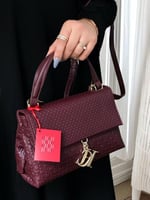 حقيبة سي اتش عنابي