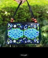 حقيبة يد مطرزة بالزهور