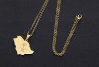 تعليقة بشعار الملكة العربية السعودية